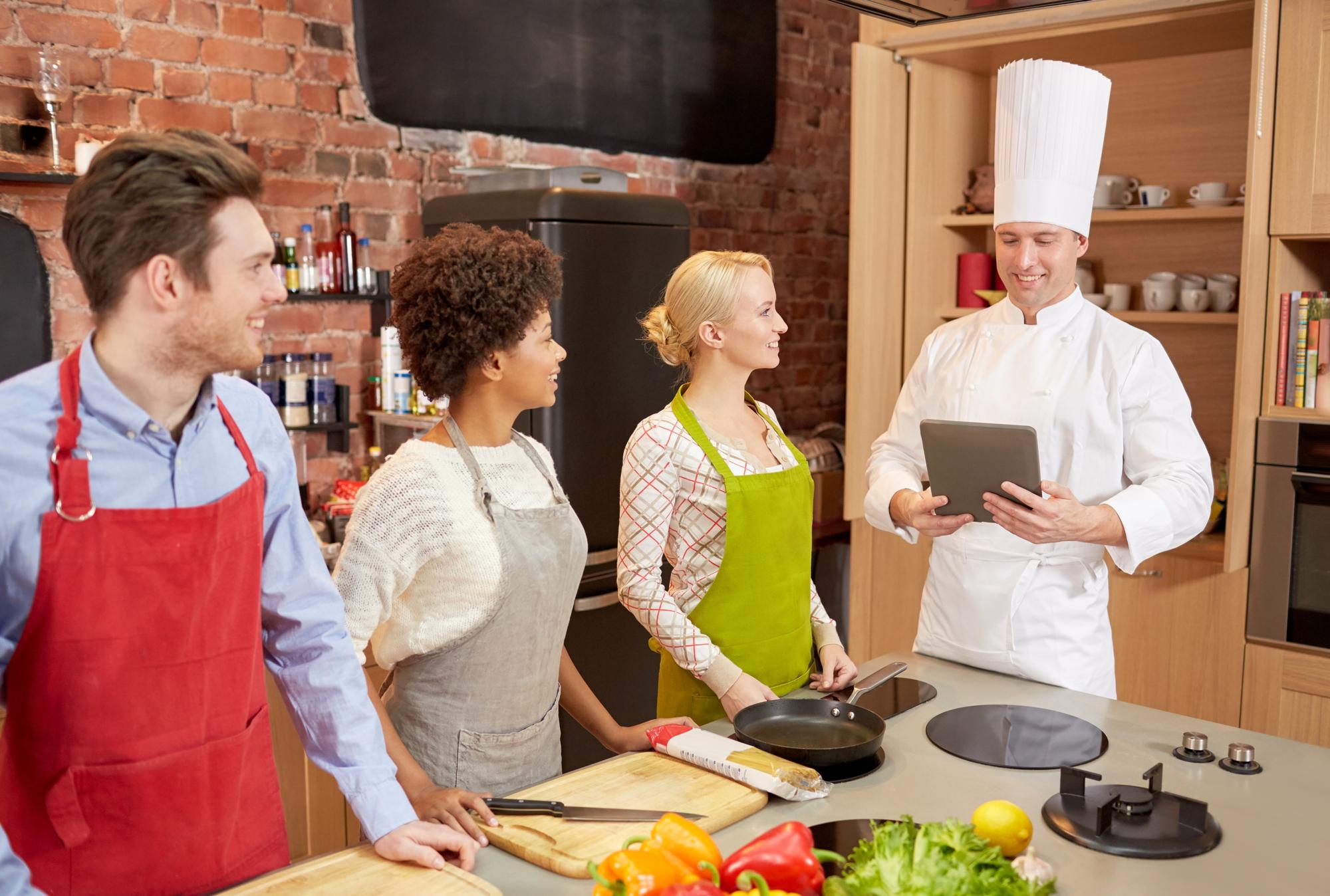 Students practicing in a professional kitchen