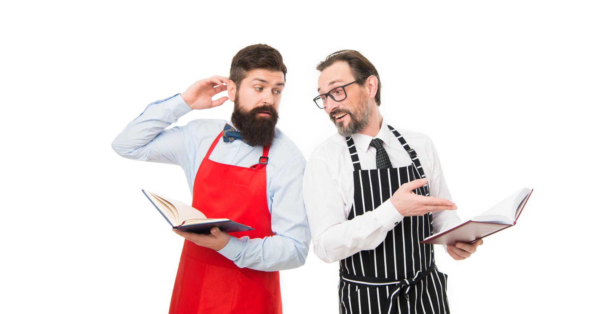 Two chefs sharing a plating technique
